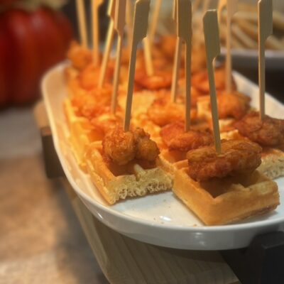 mini chicken bites with belgian waffle bites on a platter