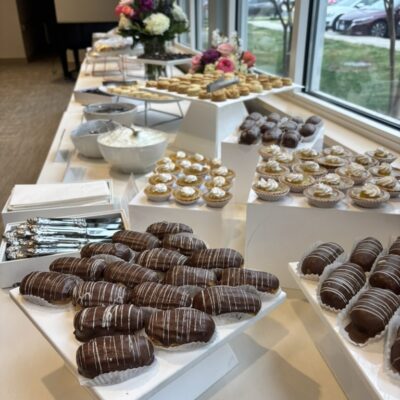 display of desserts on white risers