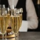 glasses of champagne and waiter in restaurant, closeup. space for text